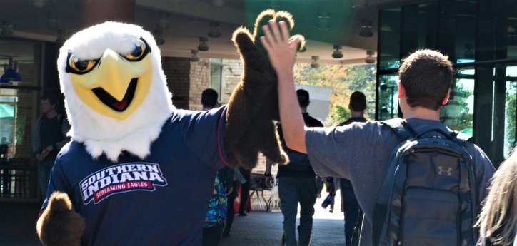 Archie giving a student a high five